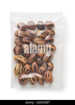 Top view of nutmeg seeds with mace in plastic bag isolated on white Stock Photo