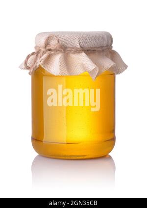 Front view of honey glass jar isolated on white Stock Photo