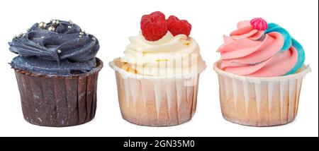 Three cupcakes close up isolated on white background Stock Photo