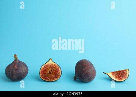 Fig on blue background, space for text Stock Photo