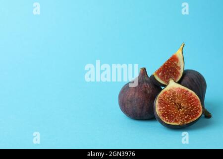Fig on blue background, space for text Stock Photo