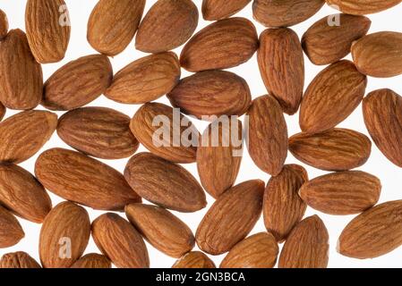 Almonds isolated on white, almond nut pattern in top view, texture for graphic designing Stock Photo