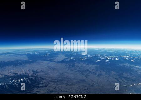 Earth's atmosphere from space, on a dark background. Elements of this image were furnished by NASA. Stock Photo