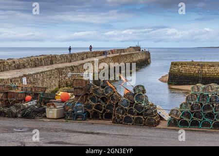 Lobster pots by the harbourside at St Andrews harbour in Fife, Scotland. Stock Photo