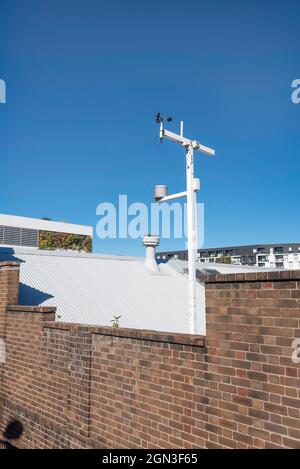 A remote-controlled remote weather station including an anemometer mounted on a roof line at Sydney's Tramsheds building in Australia Stock Photo