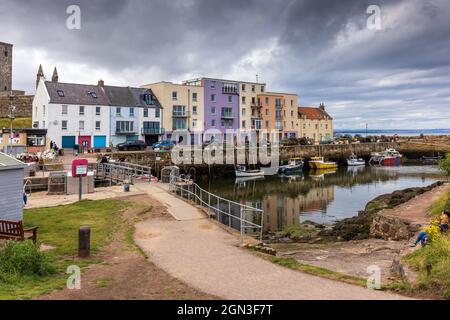 Moored fishing boats at the picturesque harbour of St Andrews in Fife on the east coast of Scotland. Stock Photo