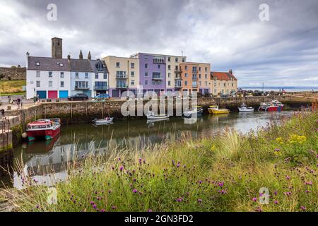 The picturesque harbour and coloured houses of St Andrews in Fife on the east coast of Scotland. Stock Photo