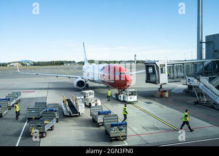 Oslo, Norway. September 2021. the ground attendant at work in the aircraft parking area at Oslo-Gardermoen airport Stock Photo