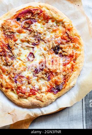 Directly above shot of Tuna Pizza with Red Onion and cheese Stock Photo