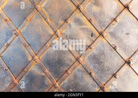 Rusty metal texture as background with streaks of rust. Old gate of iron covered with rust Stock Photo