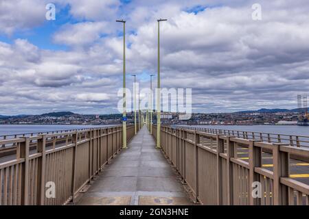 Looking down the pedestrian and cycle walkway on the Tay Road Bridge across the River Tay from Newport-on-Tay to Dundee. Stock Photo