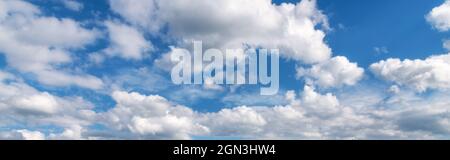 Beautiful blue sky with clouds at sunny bright day in summer Stock Photo