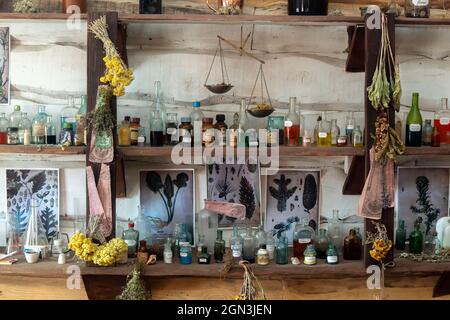shelves of bottles with ancient medicines of the ancient pharmacist Stock Photo