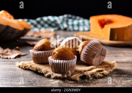 Pumpkin muffins on wooden table Stock Photo