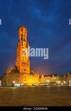 Belfry tower and Grote markt square in Bruges, Belgium on dusk in twilight Stock Photo