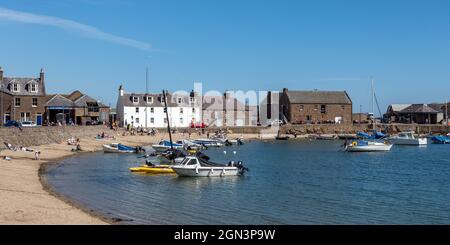 The popular sandy beach in the picturesque Stonehaven harbour, Aberdeenshire, Scotland. Stock Photo