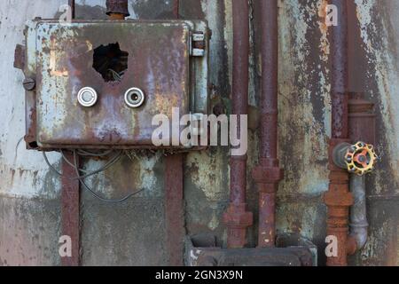 Old unused electric power distribution box close up shot on abandoned building Stock Photo