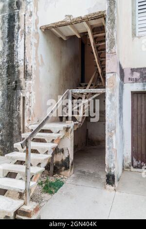 Dilipitated concrete block of flats in Gibara village, Cuba Stock Photo