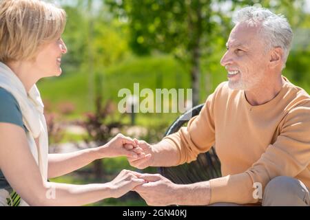 Two middle-aged people in love looking at each other Stock Photo
