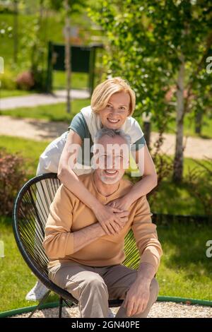 Joyous married couple posing for the camera Stock Photo