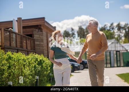 Loving couple gazing at each other during the morning stroll Stock Photo