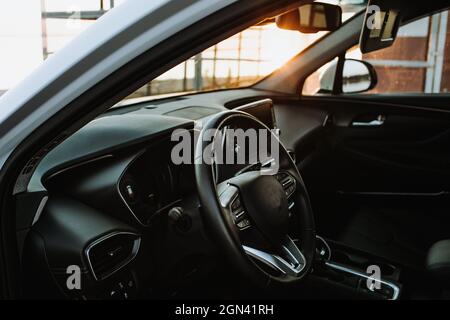 Luxury car interior - steering wheel, shift lever and dashboard Stock Photo