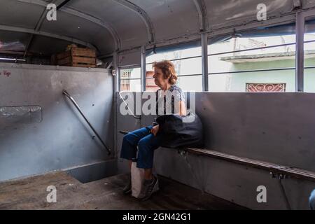 CIENFUEGOS, CUBA - FEBRUARY 12, 2016 Passenger in a passenger truck Stock Photo