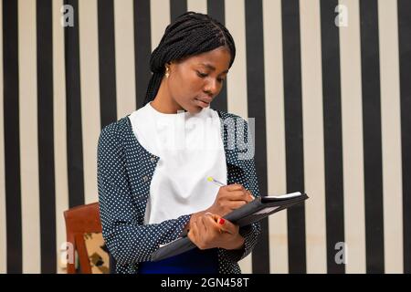 Woman in a business outfit checking the documents. Stock Photo