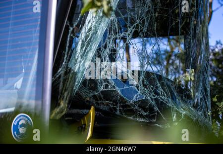 Plate, Germany. 22nd Sep, 2021. After a bus accident with several injured primary school pupils, the vehicle is heavily damaged in the ditch. The bus, which was carrying more than 30 children from a primary school and two adult passengers, left the road and crashed into a tree. Credit: Jens Büttner/dpa-Zentralbild/dpa/Alamy Live News Stock Photo