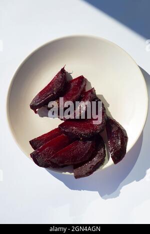 Beet slices on a plate. Cooked beets. Vegetables. Roots. Stock Photo
