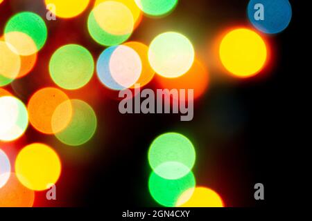 blurred defocused christmas lights bokeh on a black background Stock Photo