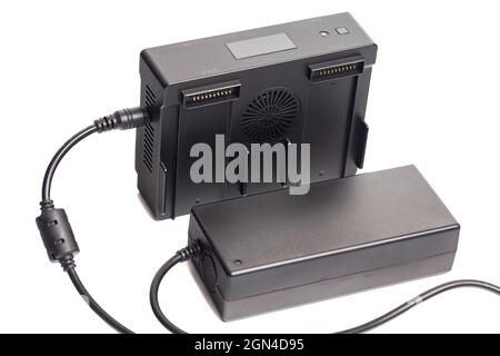 Drone battery charger hub with digital display isolated on white. Stock Photo