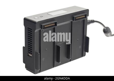Drone battery charger hub with digital display isolated on white. Stock Photo