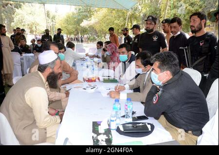 Deputy Commissioner Quetta, Irfan Nawaz Memon listening the problems of citizens during the open courts held in Quetta on Wednesday, September 22, 2021. Stock Photo
