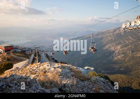 17 September 2021, Oludeniz, Turkey: Babadag mountain Cableway, (teleferik) at sunset Stock Photo