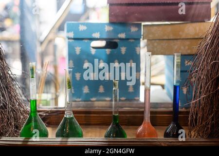 Chemistry laboratory. Conducting a chemical experiment. Experiments in the laboratory. Flasks and test tubes with colored liquid. The child conducts Stock Photo