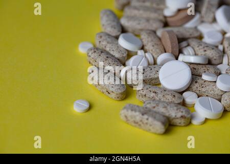 heap of different pills textured background Stock Photo