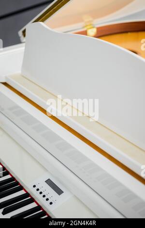 white Grand piano in a beautiful light interior Stock Photo