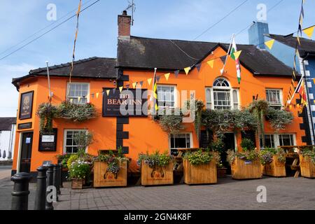 Exterior view of The Bear Inn restaurant bar and hotel in Llandovery town centre with flowers in wood containers Carmarthenshire Wales UK KATHY DEWITT Stock Photo