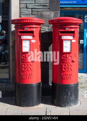 Two Royal Mail post boxes side by side in Keswick, Cumbria, England, UK Stock Photo