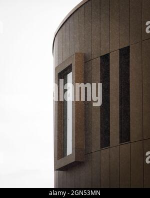 Vertical shot of a white concrete building under the blue sky Stock ...
