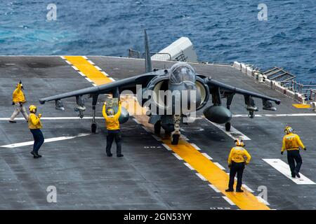 Indian Ocean, At Sea. 11 September, 2021. U.S. Navy sailors conduct pre-flight checks on a Marine Corps AV-8B Harrier fighter aircraft, attached to Marine Attack Squadron 214, on the flight deck of the Wasp-class amphibious assault ship USS Essex September 11, 2021 in the Indian Ocean.  Credit: MC3 Isaak Martinez/U.S. Navy/Alamy Live News Stock Photo