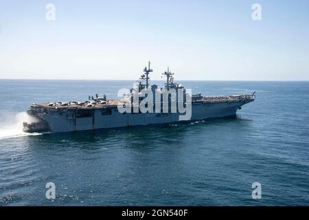 Pacific Ocean, At Sea. 26 March, 2021. A U.S. Marine Corps LCAC hovercraft enters the well deck of the Wasp-class amphibious assault ship USS Essex underway conducting routine operations March 26, 2021 in the Pacific Ocean.  Credit: MC3 Isaak Martinez/U.S. Navy/Alamy Live News Stock Photo