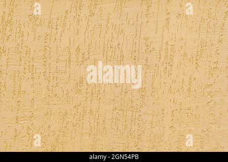 Light beige textured surface is the plastered surface of the constructed building. Stock Photo