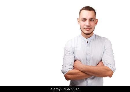 Happy male person portrait isolated against white background. Guy folded arms. Waist up studio shot. Stock Photo
