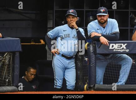 St. Petersburg, United States. 22nd Sep, 2021. Toronto Blue Jays manager Charlie Montoyo (L) and coach John Schneider (R) watch from the dugout during the first inning against the Tampa Bay Rays at Tropicana Field in St. Petersburg, Florida on Wednesday, September 22, 2021. Photo by Steven J. Nesius/UPI Credit: UPI/Alamy Live News Stock Photo