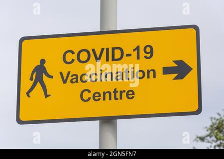 Covid-19 Vaccination Centre sign, Titanic Quarter, City of Belfast, Northern Ireland, United Kingdom Stock Photo