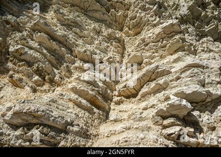 White layered rocks texture, geology close-up, cliff on coast of Lefkada island in Greece. Summer wild nature material surface close-up Stock Photo
