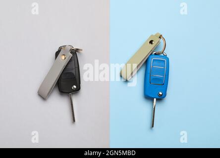 Car keys with leather keychains on color background Stock Photo