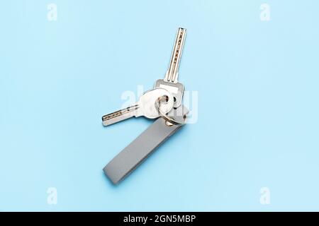 Keys with leather keychain on color background Stock Photo
